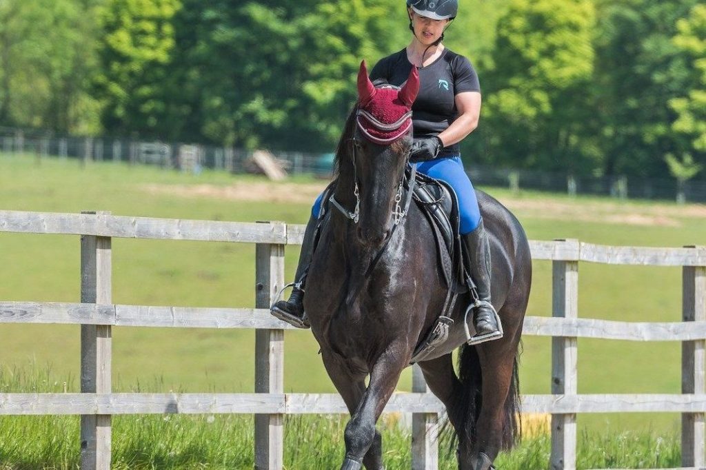 Horse rider improving performance on her horse